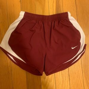 Maroon Nike running shorts